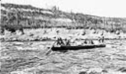 Loaded scow leaving foot of island, at Grand Rapids, Alta. Athabasca River, Alta