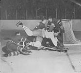 Hockey game between Montreal Canadiens and Toronto Maple Leafs with goal-keeper Johnny Boyer? ca. 1960's
