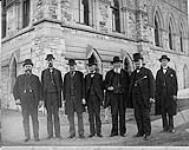 [Group of Senators near Parliament Building] ca. 1885.