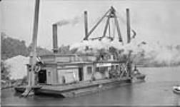 Dredging the boat channel at Wellington, Ont., June, 1941 June 1941