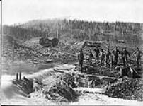Hamlin and Davis [claim] on lower half of No. 9. Flood caused by a break in the dam just above, Last Chance Creek ca. 1900