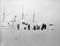 Snow houses [igloos] beside "Neptune", Fullerton, [N.W.T.] [between 1903-1904].