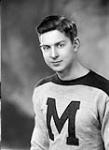 John R. McCormack, centre, St Michael`s College Hockey Team 29 Mar. 1944