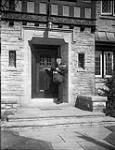 Postman delivering mail 29 Mar. 1937