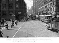 Traffic conditions at Bay and Front Streets. [Toronto, Ont.] 13 June 1947