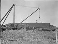 (Hudson Strait Expedition) Derrick lifting case containing fuselage of Fokker 'Universal' aircraft, Base 'B' n.d.