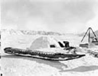 (Hudson Strait Expedition). Komatik and completed igloo, Wakeham Bay, Quebec [Nunavut], December 1927 December 1927.