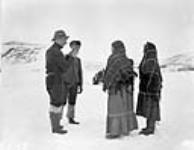Inuit women with personnel of Base 'C' Wakeham Bay, Quebec [Nunavut], 1928 1928.