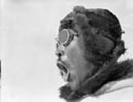 Inuit man wearing snow goggles 1928.