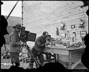 (Hudson Strait Expedition). Mr. George Valiquette photographing model of Fokker 'Universal' aircraft at Base 'C' 1928