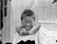 [Unidentified Inuk boy smiling for the photographer, Kangiqsujuaq, Nunavik] Original title: Eskimo child, Wakeham Bay, Quebec 1928.