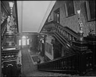 Government House, Toronto, Ontario. Staircase, looking down main hall to principal entrance of residence [1912]