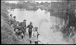 Boys fishing ca. 1910