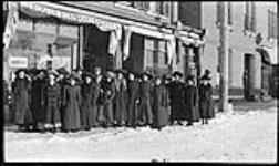 Group of ladies outside Handford Studio ca. 1910