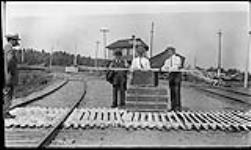 Men at the junction of the C.N.R. and K. and P. R.R. railway lines ca. 1905-1915