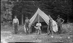 Men camping ca. 1910