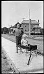 Children playing with a wagon ca. 1905 - 1915