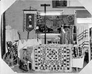 An exhibition of curios: a mat made by Eskimo of seal skin; a dog saddle, child's fur boots; water boots of seal skin; a beaded moss bag; a deerskin beaded coat: and an Indian rug or blanket; and Indian rag mat (Thunder Bird) n.d.