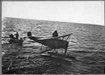 Baby Avro seaplane used for seal spotting alongside S.S. NEPTUNE of Job Bros. & Co 1923