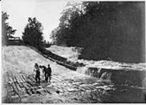 Chats Falls timber slide, Fitzroy Harbour Ont. Repairing the slide 5 July 1899