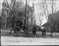 Coachma William Rickett with Colonel J.W. Little's carriage, 245 Dufferin Avenue 9 Apr. 1912