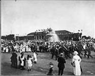 [Crowds around Gooderham Fountain. Canadian National Exhibition, Toronto, Ontario.] c. 1912