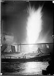 Gas well burning at night, Sarnia, [Ont.] 1901