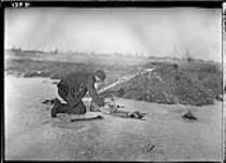 Muskrat trapping - setting the trap June 1908