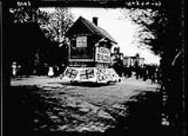 Victoria Day [parade], T. Graces' house float 24 May, 1907