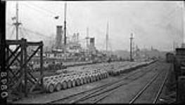 Barrels of molasses from Barbadoes on dock in Montréal 3 June, 1914