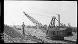 Big shovel emptying a load [during the construction of the] Welland Canal 3 July, 1914