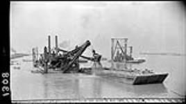 Dredges and scows at Port Weller [during the construction of the] Welland Canal, [Ont.] 18 Sept. 1914