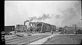 New G.T.R. bridge with train showing the diversion, [during the construction of the] Welland Canal, [Ont.] 18 Sept. 1914