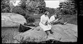 Hazel and Harold with Auto Kodak [cameras], Long Lake Aug. 1915