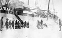 Group of Inuit from Ingloolik Island beside the S.S. "Arctic" at Albert Harbour 22 Apr. 1907.
