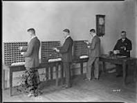 Clerks undergoing case examination, Post Office Dept. April, 1927
