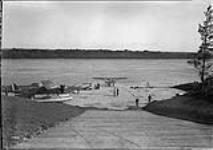 Aircraft of the R.C.A.F. on slipway. (L.-R.): Fairchild FC-2 G-CYXK, Fairchild 71 G-CYXW. The latter is leaving on an Indian treaty money payment flight 27 June 1929