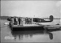 Hon. Ian Mackenzie and party watching departure of Fairchild 71B aircraft 632 of the R.C.A.F. on an Indian Treaty payment flight 14 June 1936