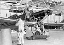 Groundcrew servicing Hawker Hurricane aircraft 315 of No.1(F) Squadron, Royal Canadian Air Force (R.C.A.F.), Rockcliffe, Ontario, Canada, 5 September 1939 September 5, 1939.