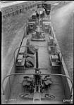 Overhead view of gondola cars of armoured train showing anti-aircraft guns and searchlight, Canadian National Railways Shops 15 July 1942