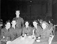 Unidentified airmen and airwomen at a station dance in the Drill Hall, R.C.A.F. Station Rockcliffe, Ontario, Canada, 29 January 1944 January 29, 1944