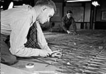 Processing of prints for tri-metyrogon mapping, No.1 Photographic Establishment, R.C.A.F., Rockcliffe, Ontario, Canada, 1 March 1945 March 1, 1945