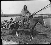 Indians about to cross Bow River [1880-1900]