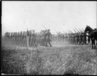 Canada's Greates Military Review. Several rows of troops in the march past General Sir Sam Hughes at Camp Borden, Ont n.d.