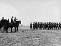 Major-General Sir Sam Hughes taking the salute during a review of Canadian troops 11 July 1916