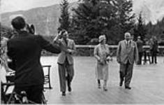 MacKenzie King, Queen Elizabeth & King George VI at Banff, Alta, 1939. Roy Tash on left with moving camera 1939
