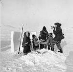Roy Tash filming Governor General Vincent Massey fishing for Arctic char with Inuit in the Canadian Arctic, 1956 1956.