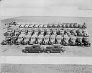 Group photo line-up of Rockcliffe M.T. vehicles 04-Jul-44