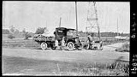 [A Ford automobile on] Dundas Street, Toronto, Ont 6 July 1940