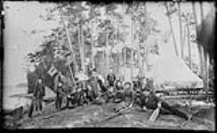A group of vacationers at Reef Island Camp, Muskoka Lakes, Ont., c. 1887 [ca. 1887].